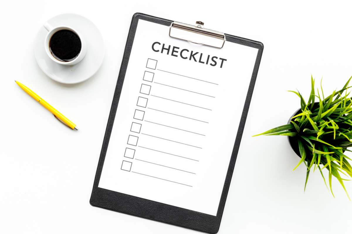 Blank checklist with space for ticks on pad on office desk