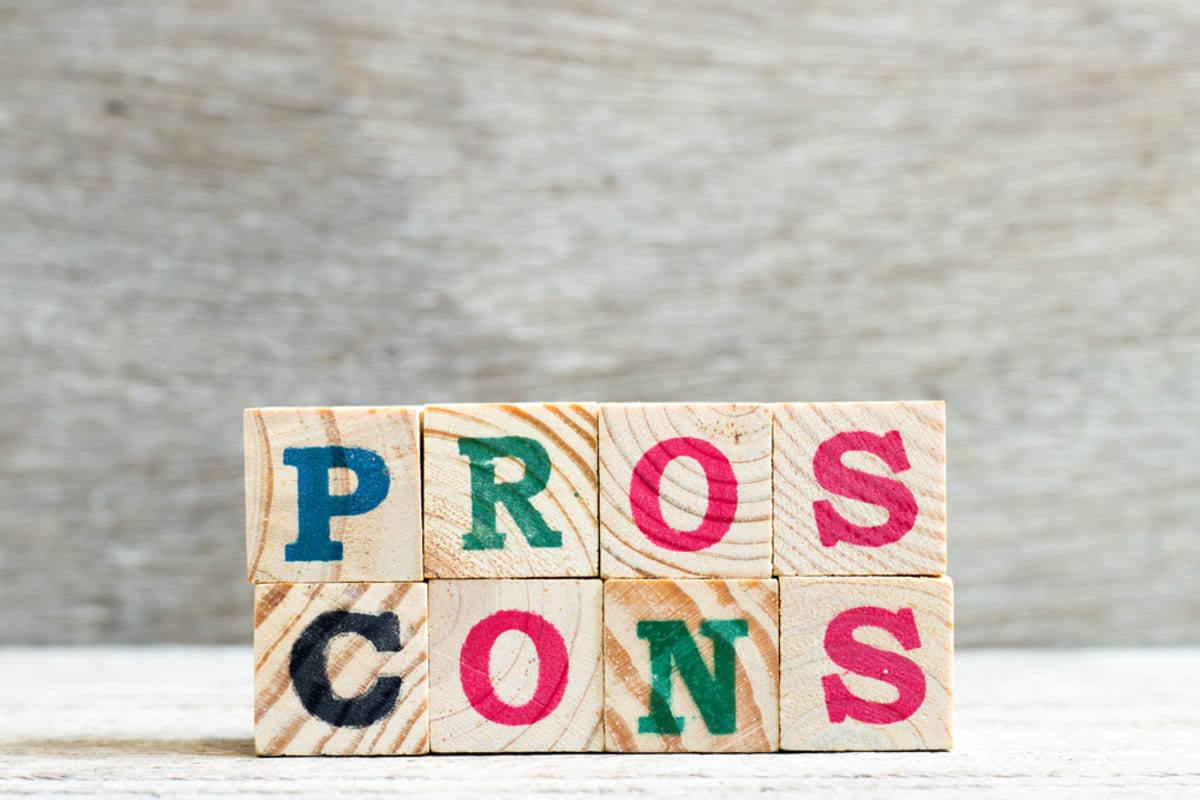 Wooden blocks that spell out pros and cons